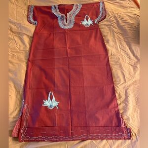 Sun dress. Light red/dark pink with a sky blue and white